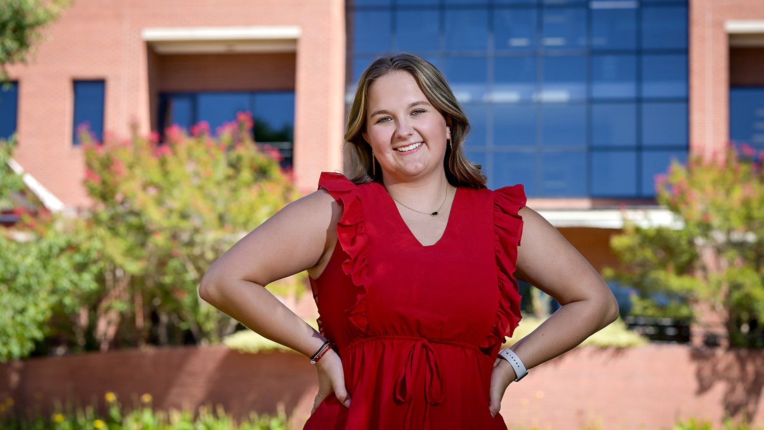 Bailey Walters stands in front of the Wilson College of Textiles.