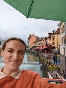 Anna Haskins posing for a selfie in Annecy, France