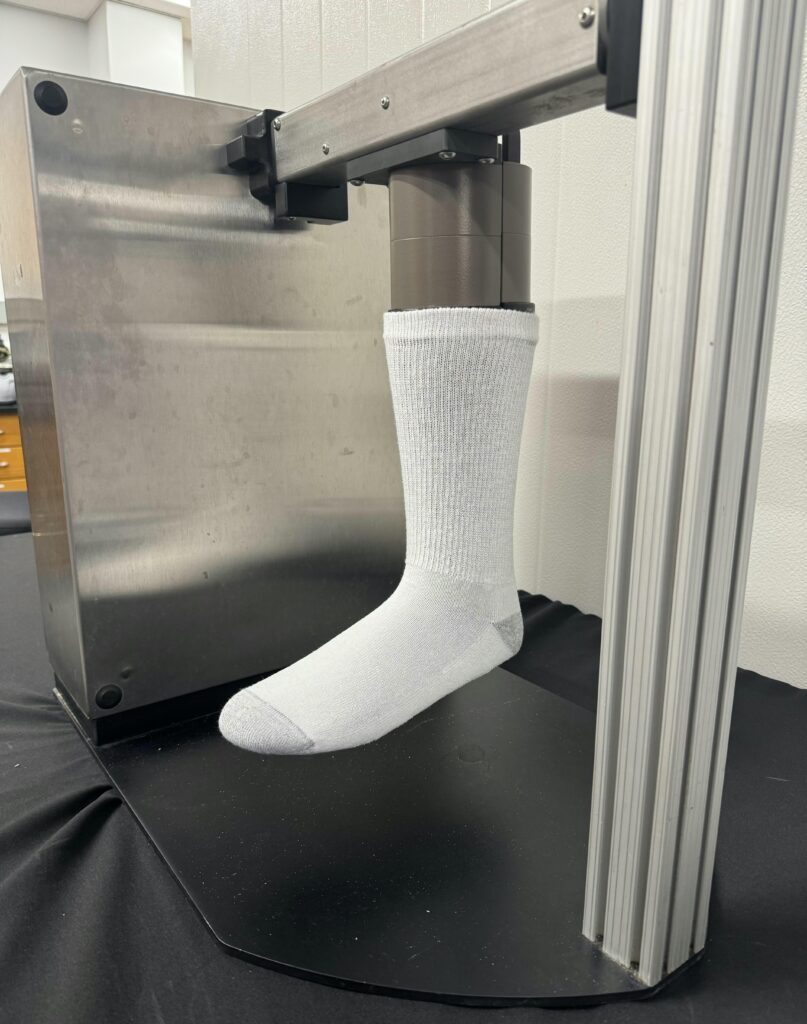 A sock modeled on machinery for thermal insulation testing.