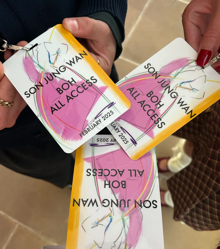 Three all-access passes for a fashion show. 