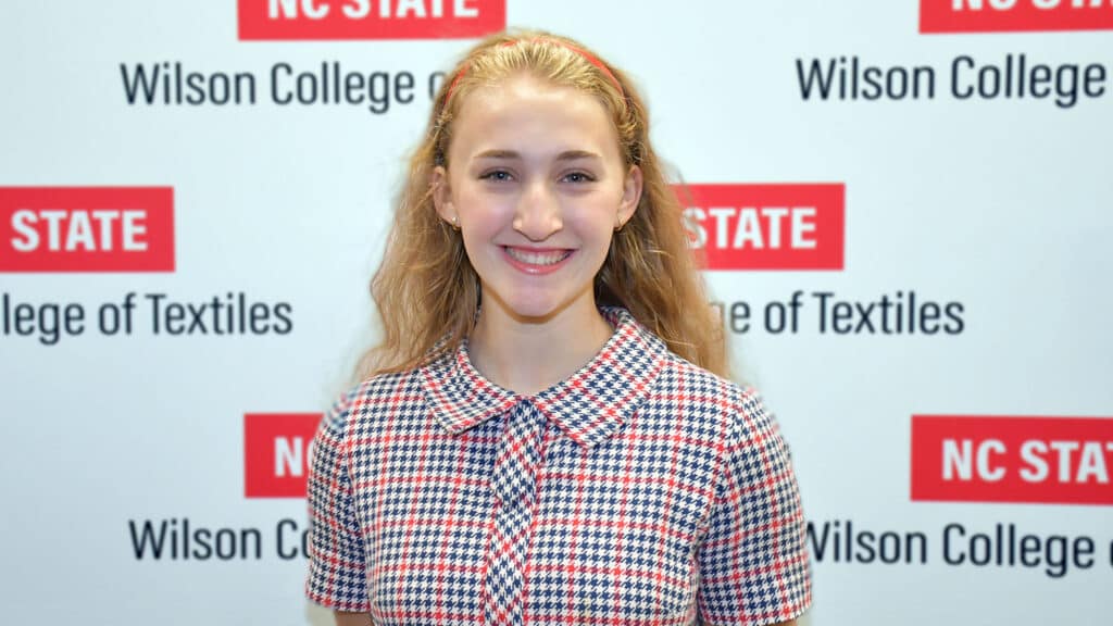 A student, Singer-London Stanley, smiling at the camera.
