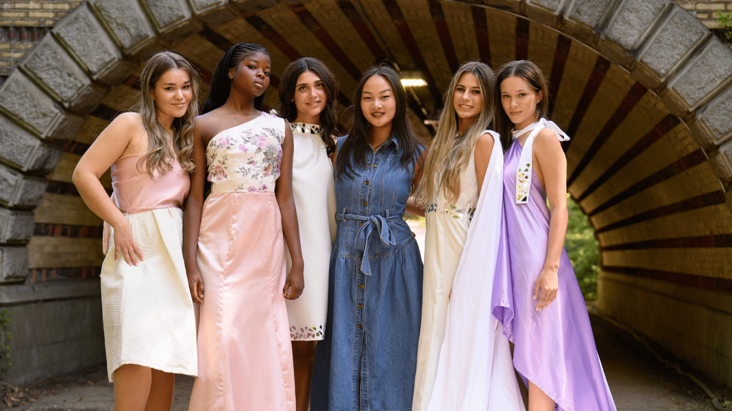Adaline Griffin poses with five models wearing pieces from her collection.
