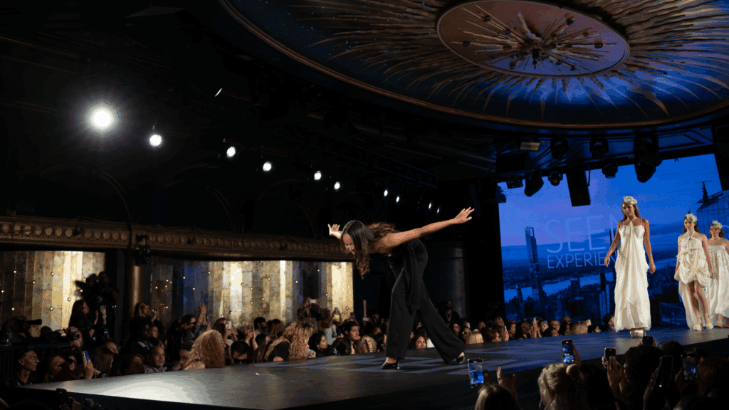 Adaline Griffin takes a bow at the conclusion of her fashion show.