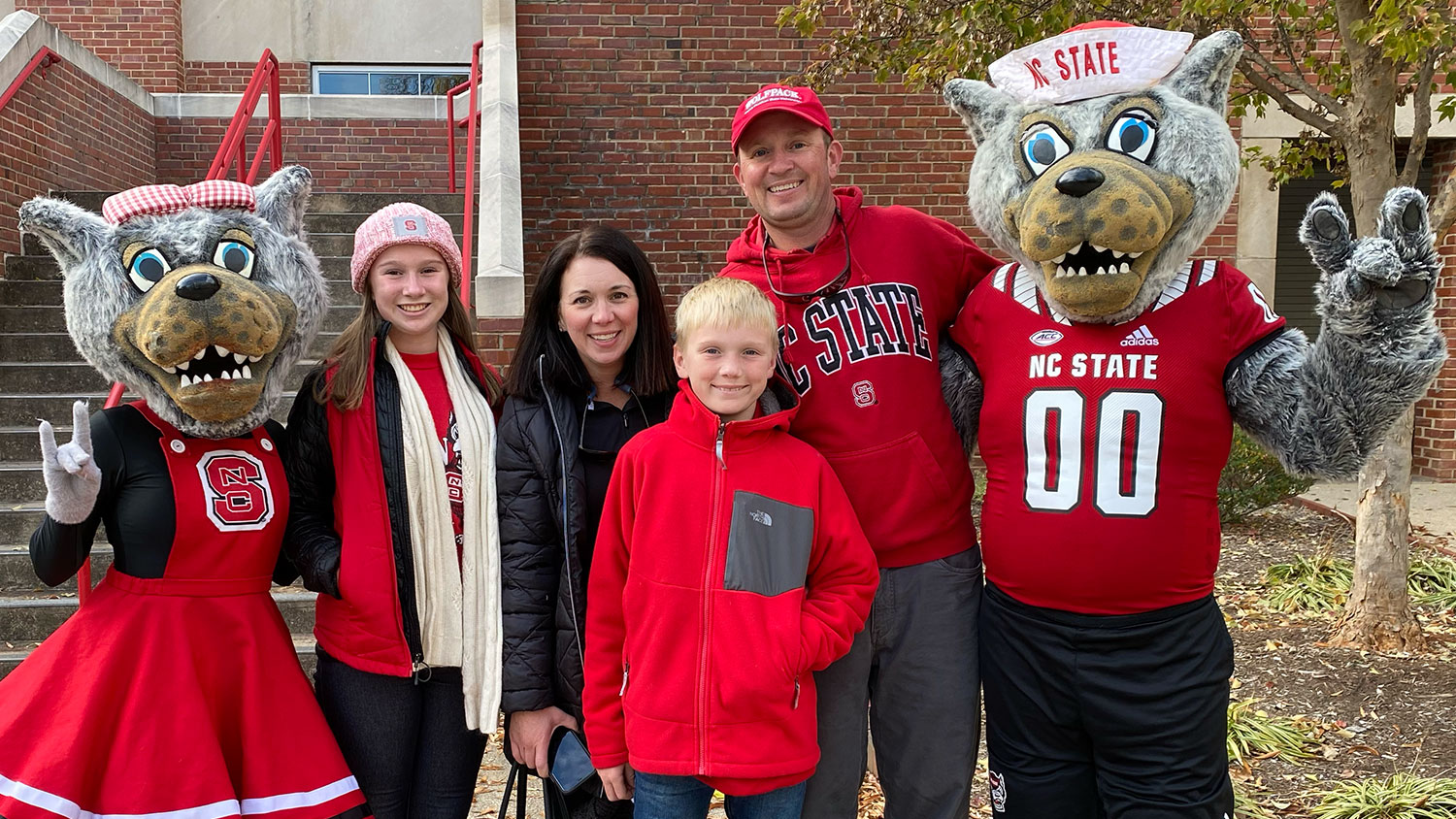 Four family members smiling