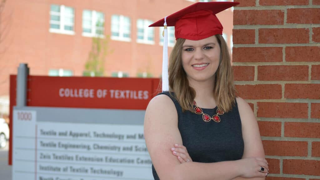Smiling image of Helen Wilson wearing her graduation regalia.