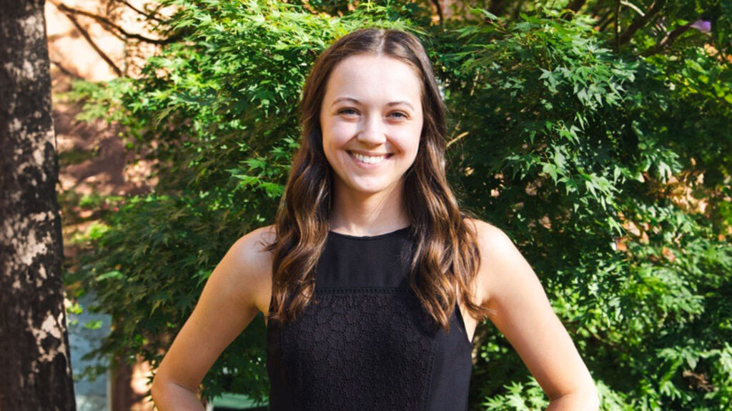 Claire Henson smiling at the camera.