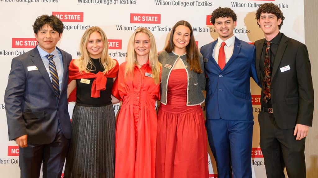 Students standing together smiling