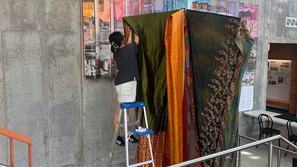 Yulan Liu draping the sari at Union Square.