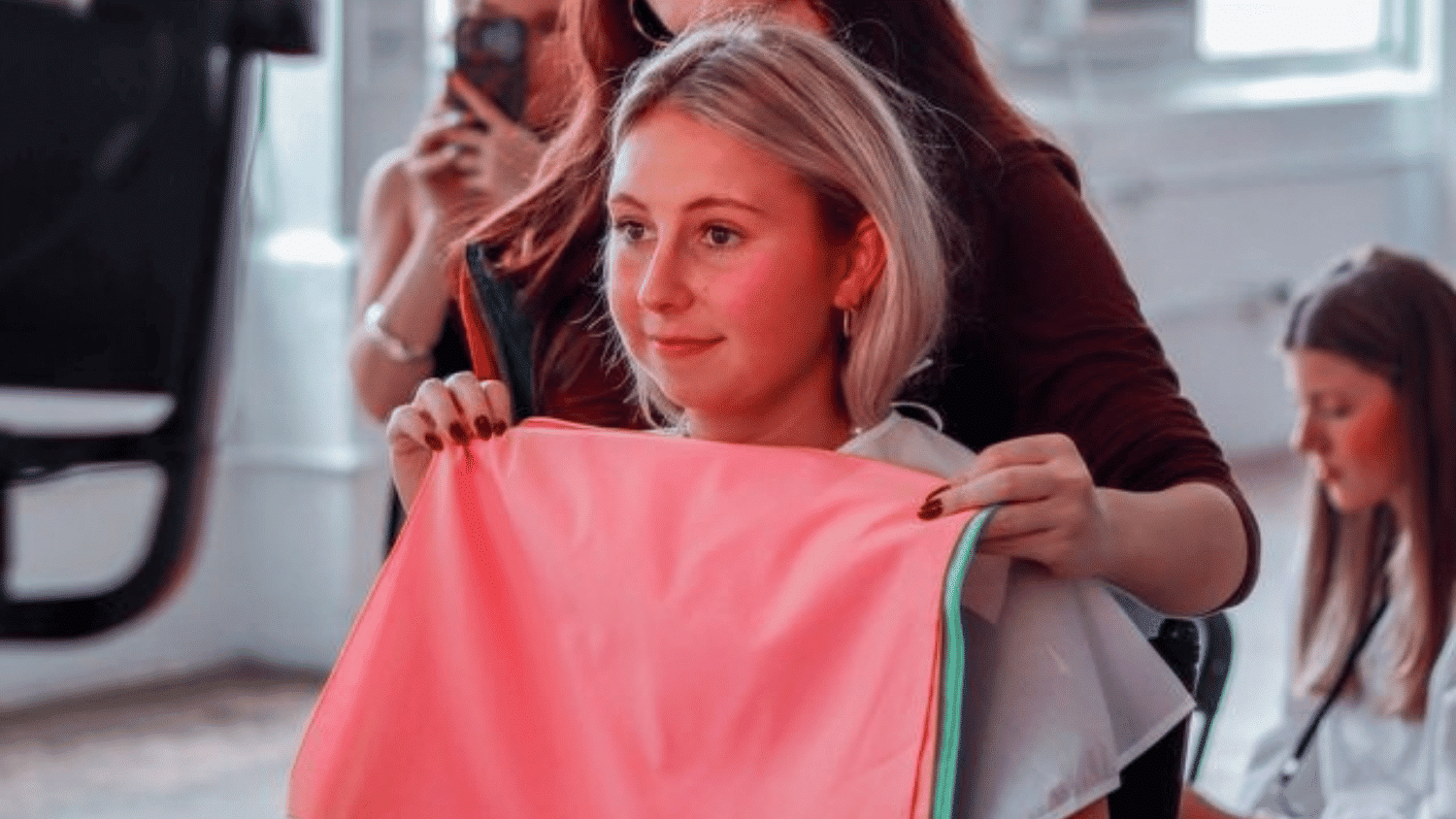 Katie Watson receiving a color analysis from an industry professional