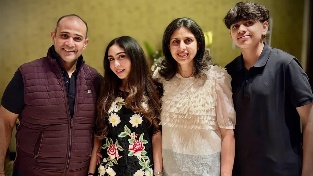 Amit Patodia stands with his wife, Shashi, his daughter, Anushree, and his son, Anirudh.