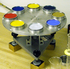 Eight test samples placed in water dishes which are placed on a vibration free turntable